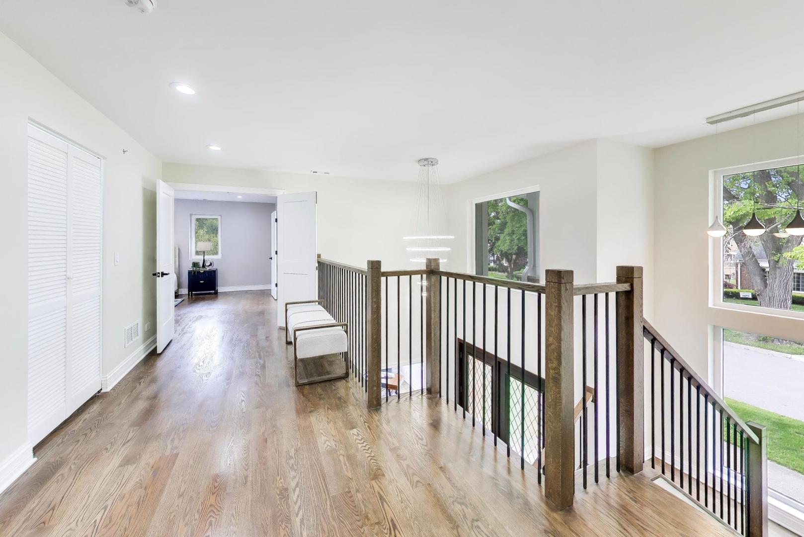1133 Fortuna Avenue Park Ridge, IL 60068 - Photo 25 of 46 a view of a hallway with wooden floor and stairs