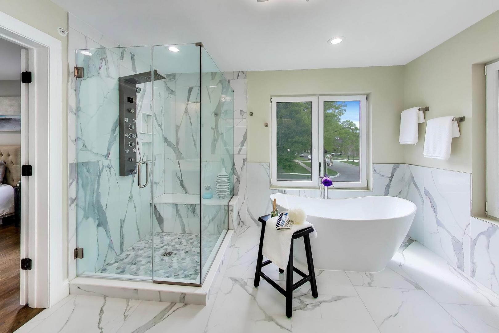 1133 Fortuna Avenue Park Ridge, IL 60068 - Photo 30 of 46 a spacious bathroom with a shower sink and mirror