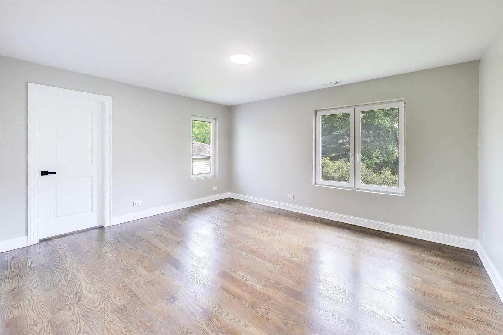 1133 Fortuna Avenue Park Ridge, IL 60068 - Photo 31 of 46 an empty room with wooden floor and windows