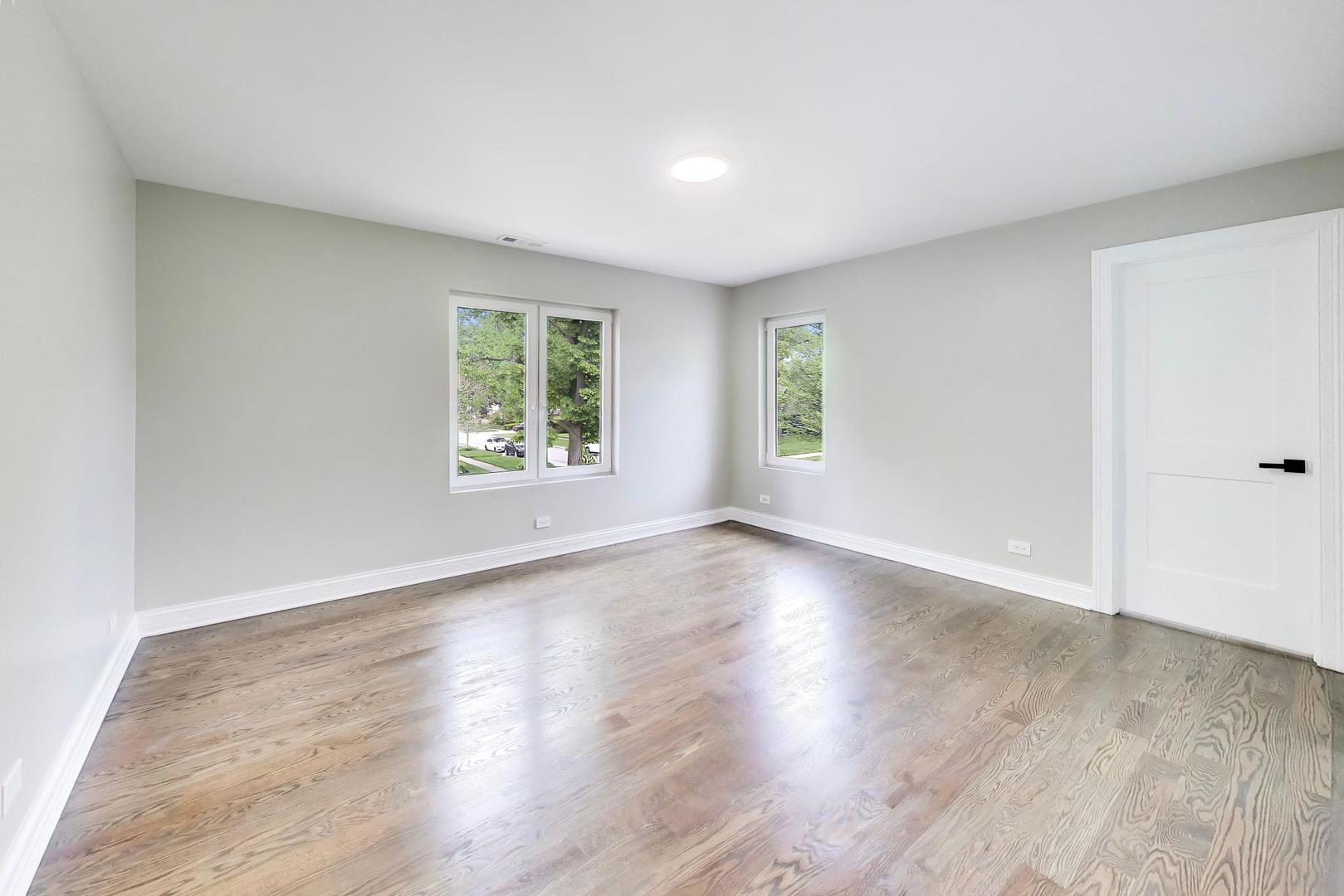1133 Fortuna Avenue Park Ridge, IL 60068 - Photo 36 of 46 an empty room with wooden floor and windows