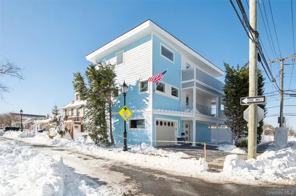 a front view of a building with snow