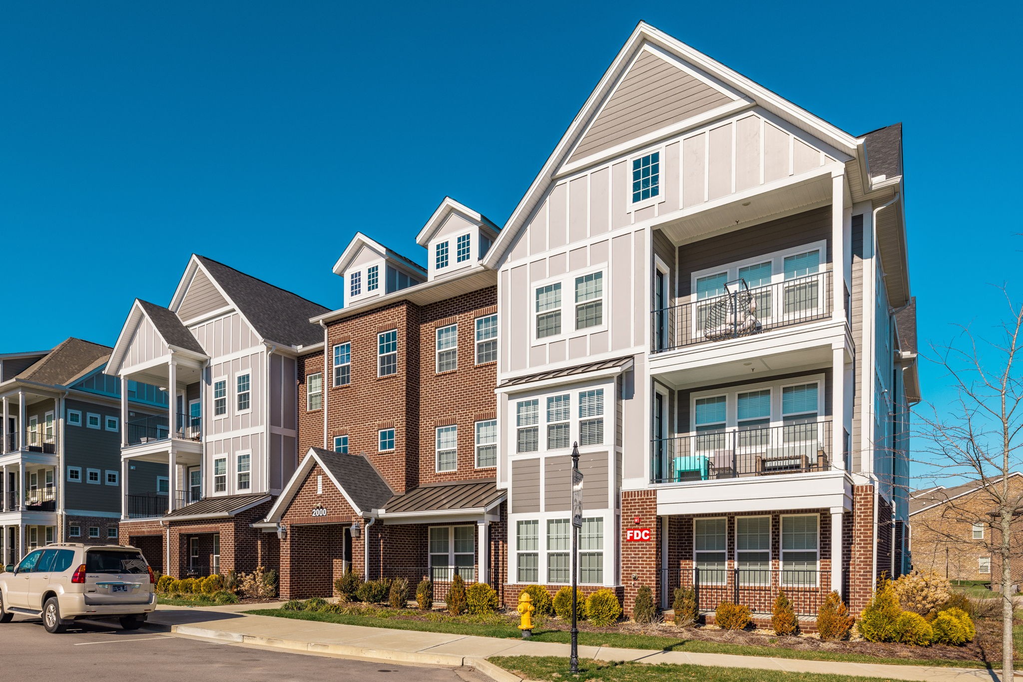 2000 Shadow Green Drive, Unit 302 Franklin, TN 37064 - Photo 1 of 19 a front view of a residential apartment building with a yard