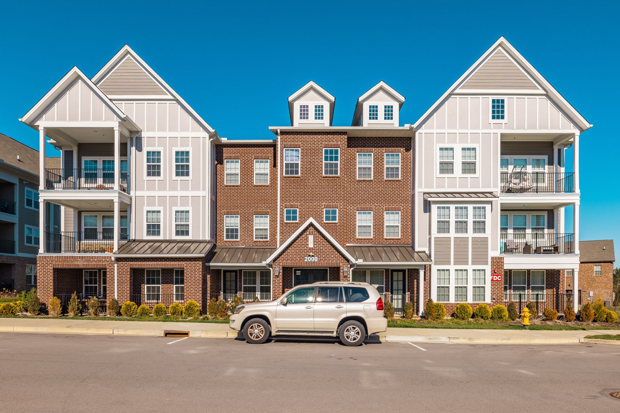 2000 Shadow Green Drive, Unit 302 Franklin, TN 37064 - Photo 14 of 19 a car parked in front of a white building