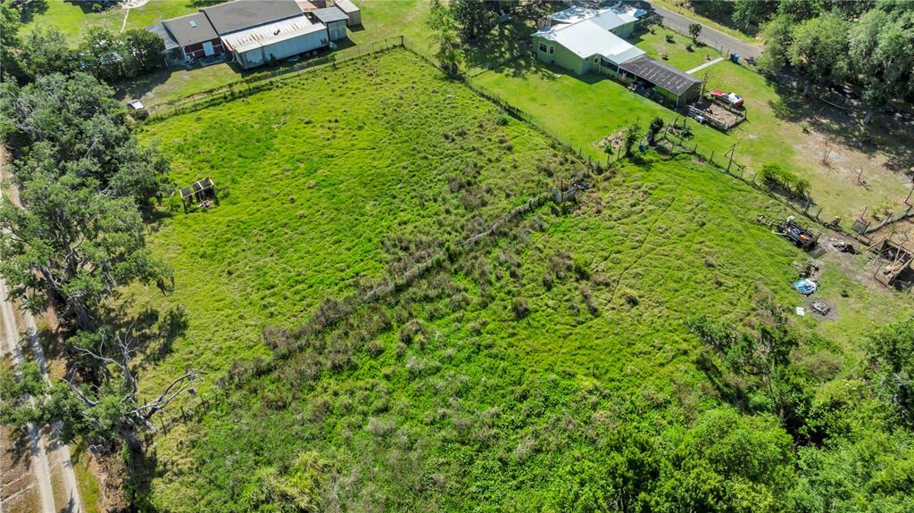 13610 Acker Road Dover, FL 33527 - Photo 11 of 53 a view of a garden with a house