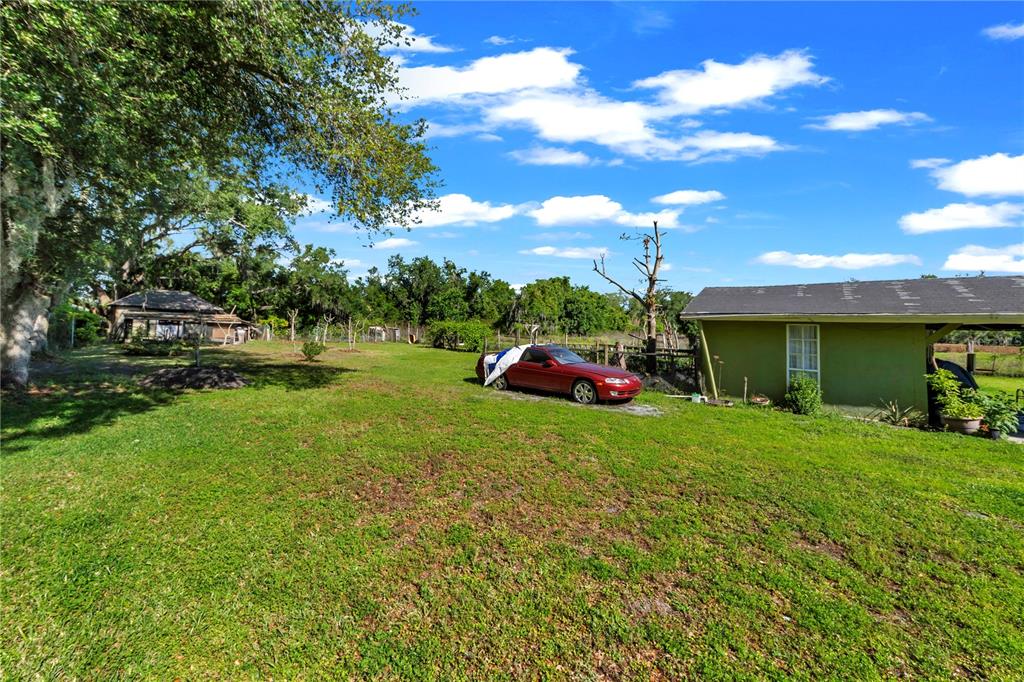13610 Acker Road Dover, FL 33527 - Photo 20 of 53 a view of a house with a back yard