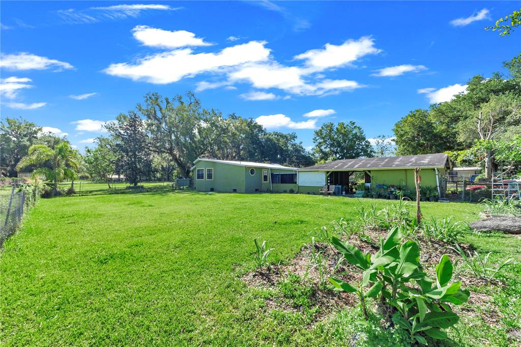 13610 Acker Road Dover, FL 33527 - Photo 25 of 53 a view of an house with backyard