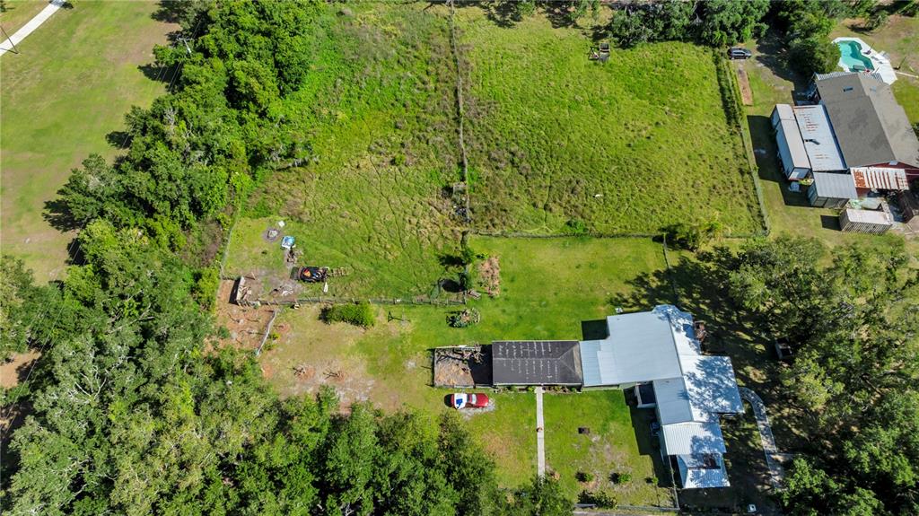 13610 Acker Road Dover, FL 33527 - Photo 3 of 53 an aerial view of a house with a yard swimming pool and outdoor seating