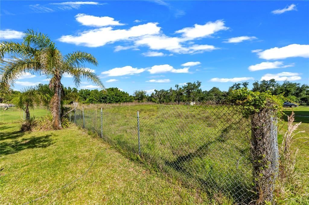 13610 Acker Road Dover, FL 33527 - Photo 34 of 53 a view of a lake with a yard