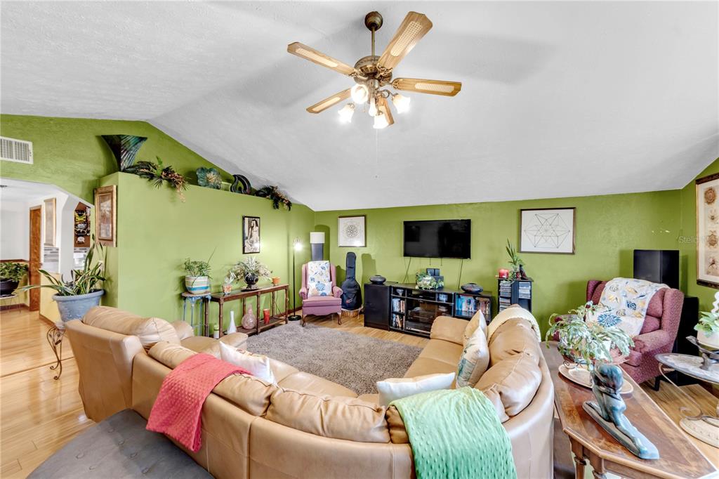 13610 Acker Road Dover, FL 33527 - Photo 37 of 53 a living room with furniture and a flat screen tv