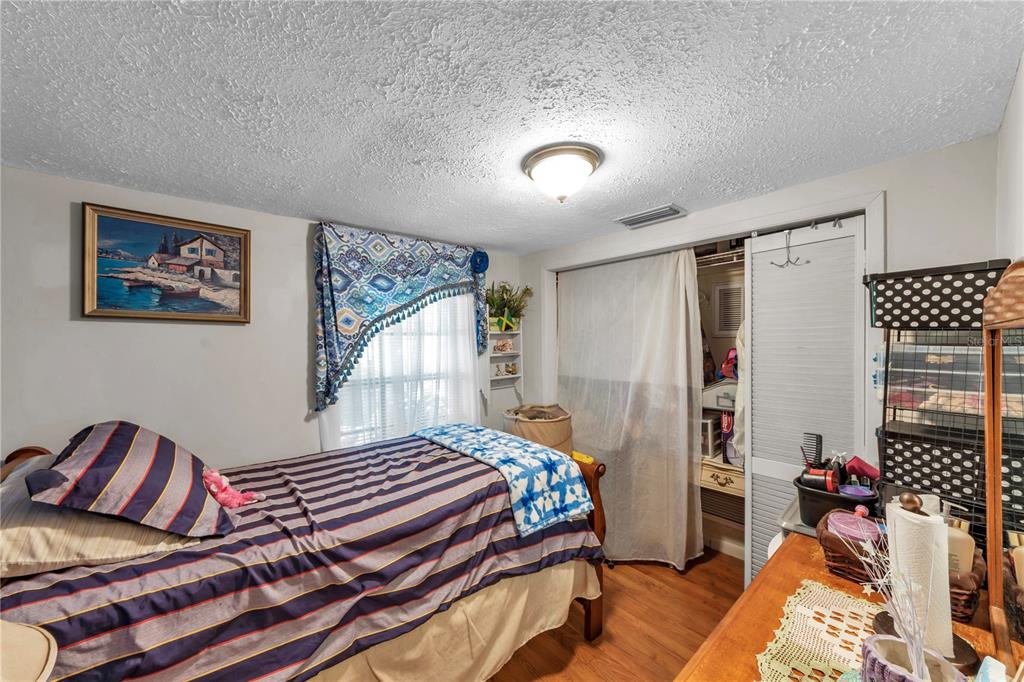 13610 Acker Road Dover, FL 33527 - Photo 39 of 53 a bedroom with furniture and a window