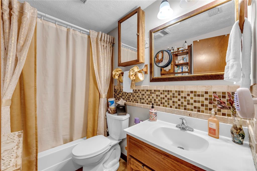 13610 Acker Road Dover, FL 33527 - Photo 40 of 53 a bathroom with a sink toilet and shower