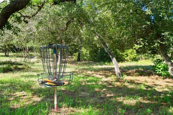 a view of a backyard with a fountain