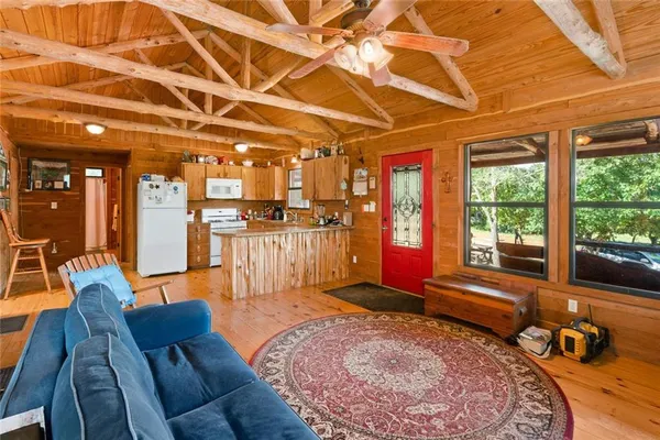 a kitchen with refrigerator and cabinets