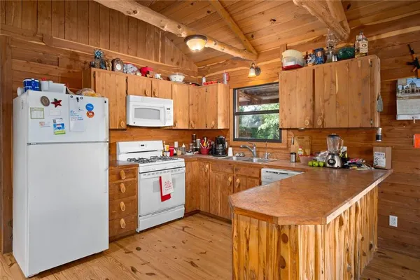 a kitchen with a stove and a microwave
