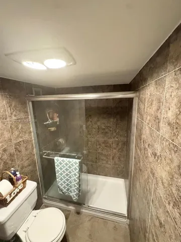 a bedroom with a bed and dresser