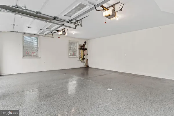 an aerial view of a house with garden space and outdoor seating