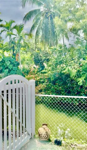 a wooden fence with trees in the background