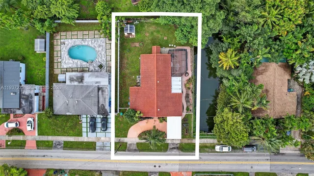 front view of a house with a garden
