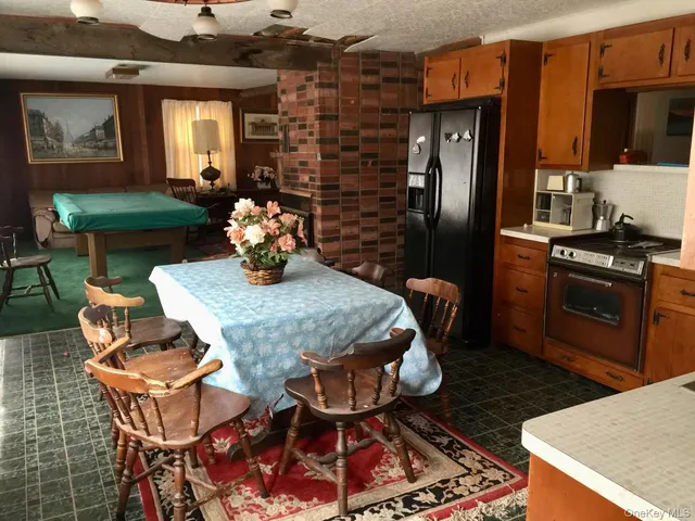 a kitchen with a table and chairs in it