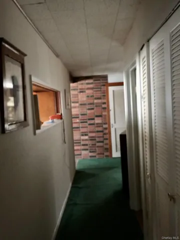 a bedroom with two beds and a window