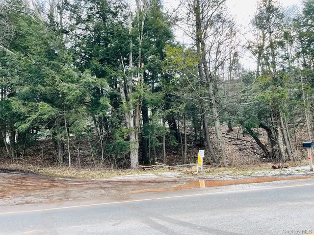 a backyard of a house with barbeque oven and outdoor seating