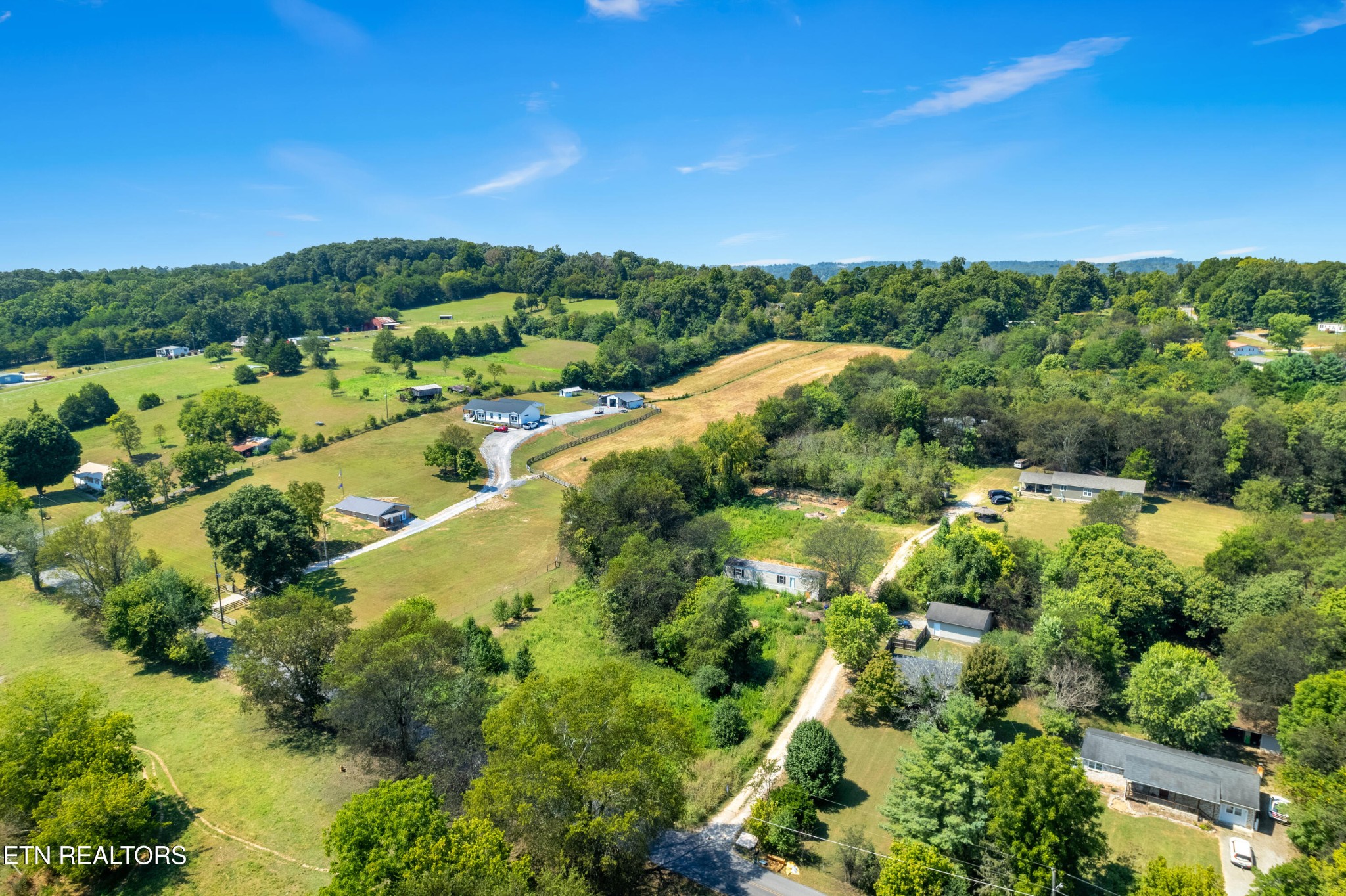 7109 Babelay Road Knoxville, TN 37924 - Photo 2 of 8 a view of a lake with a city
