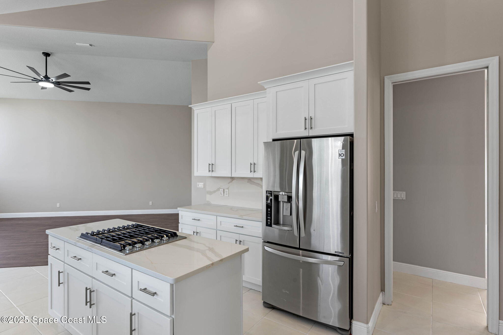 706 Palmer Way Melbourne, FL 32940 - Photo 13 of 43 a kitchen with appliances cabinets and a counter top
