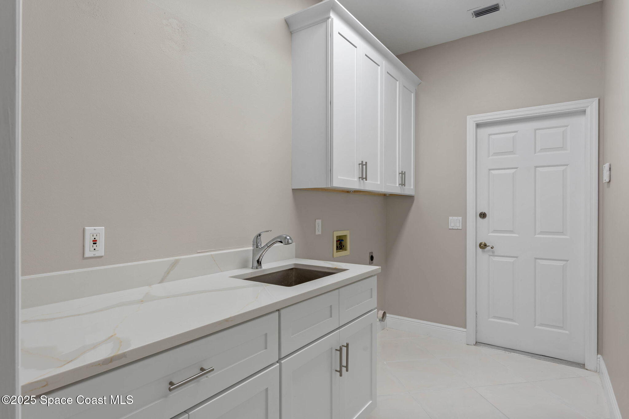 706 Palmer Way Melbourne, FL 32940 - Photo 30 of 43 laundry room