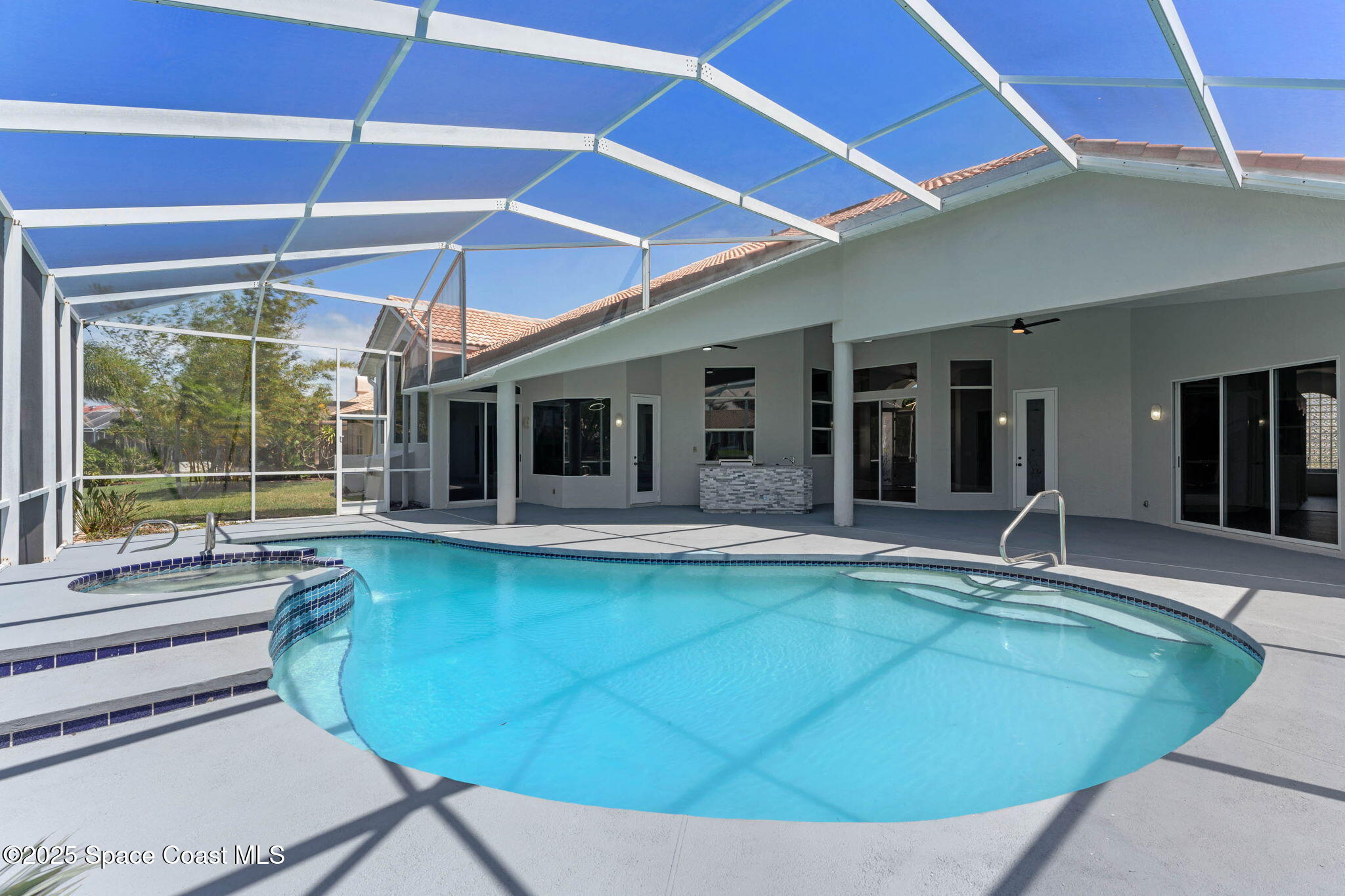 706 Palmer Way Melbourne, FL 32940 - Photo 34 of 43 a swimming pool with outdoor seating