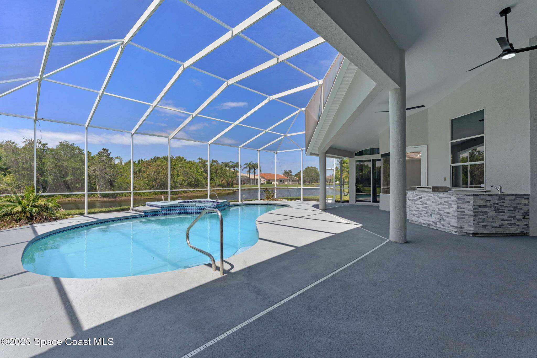 706 Palmer Way Melbourne, FL 32940 - Photo 35 of 43 a view of a patio with couches and pool with wooden floor
