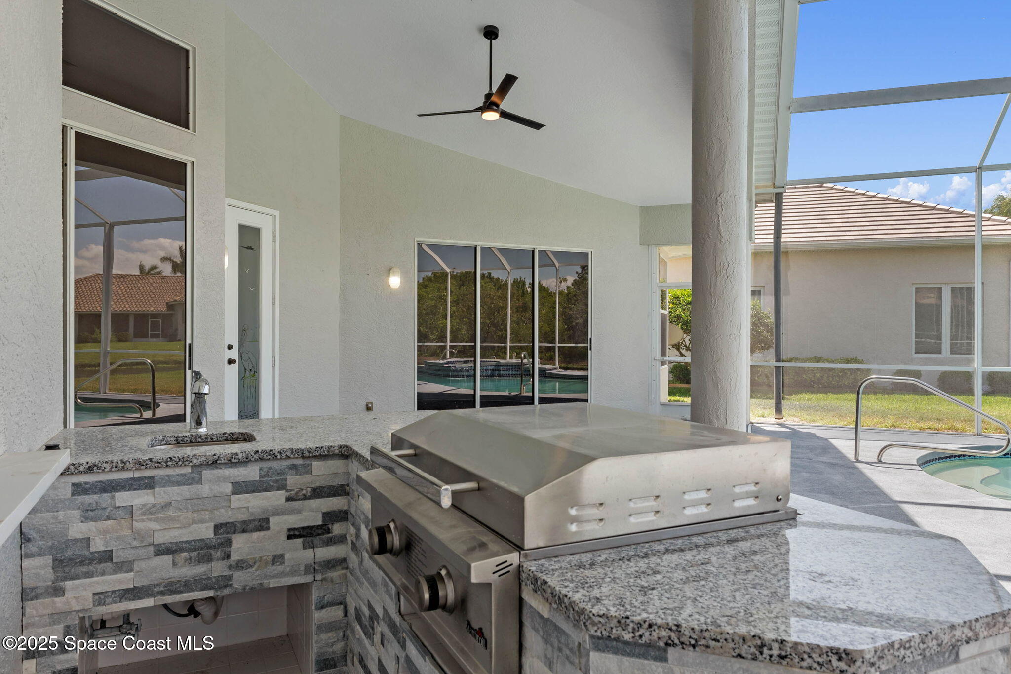 706 Palmer Way Melbourne, FL 32940 - Photo 36 of 43 a living room with couch and a large window