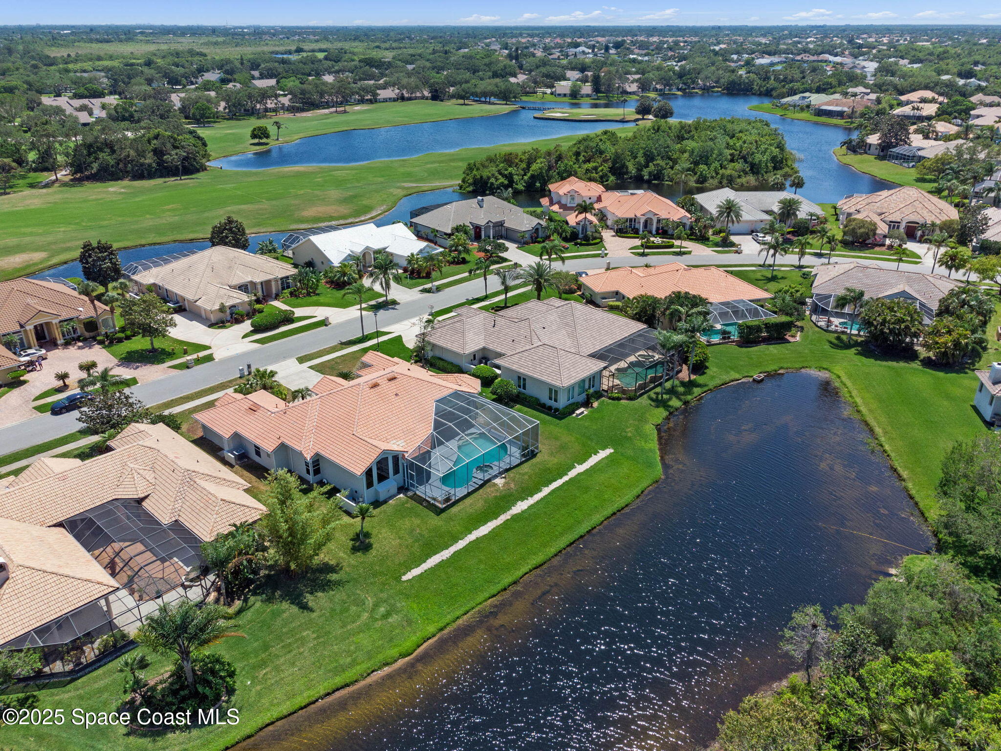706 Palmer Way Melbourne, FL 32940 - Photo 40 of 43 an aerial view of a houses with garden