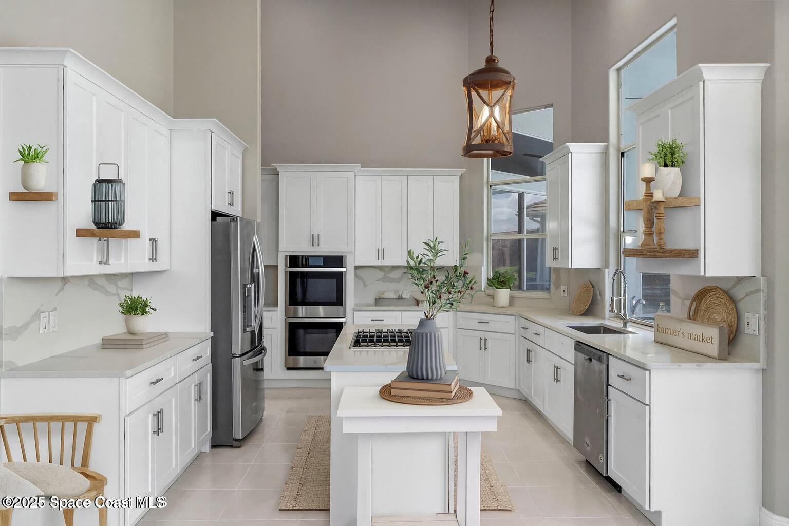 706 Palmer Way Melbourne, FL 32940 - Photo 4 of 43 a kitchen with sink cabinets and stove