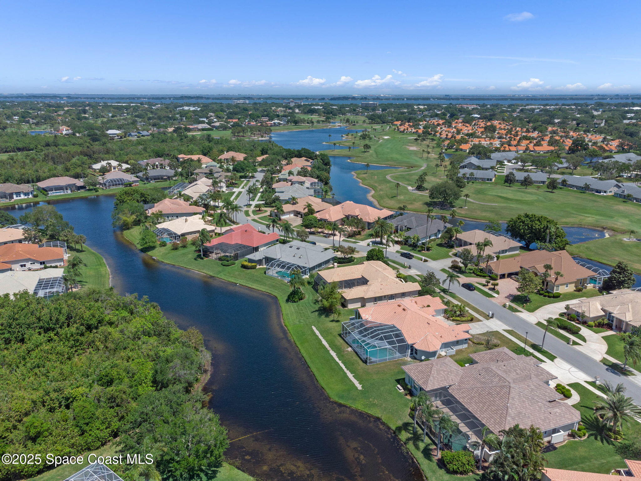 706 Palmer Way Melbourne, FL 32940 - Photo 42 of 43 an aerial view of a city with lots of residential buildings