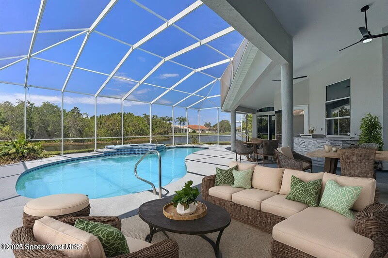 706 Palmer Way Melbourne, FL 32940 - Photo 5 of 43 a living room with furniture and a large window