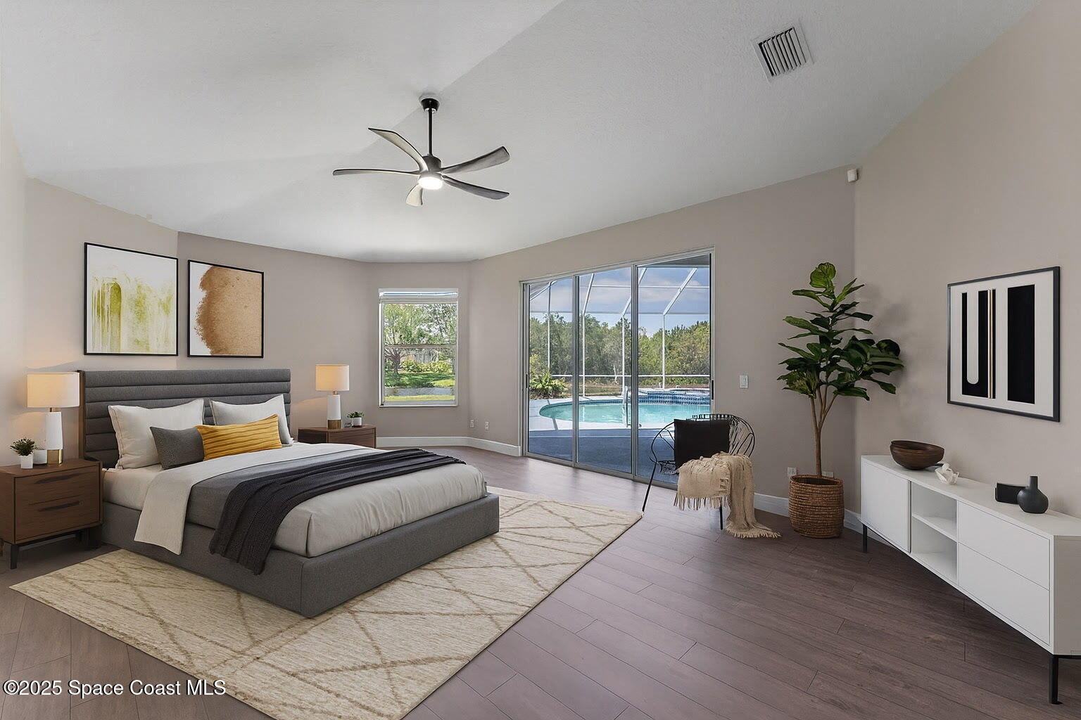 706 Palmer Way Melbourne, FL 32940 - Photo 6 of 43 a spacious bedroom with a large bed and a large window
