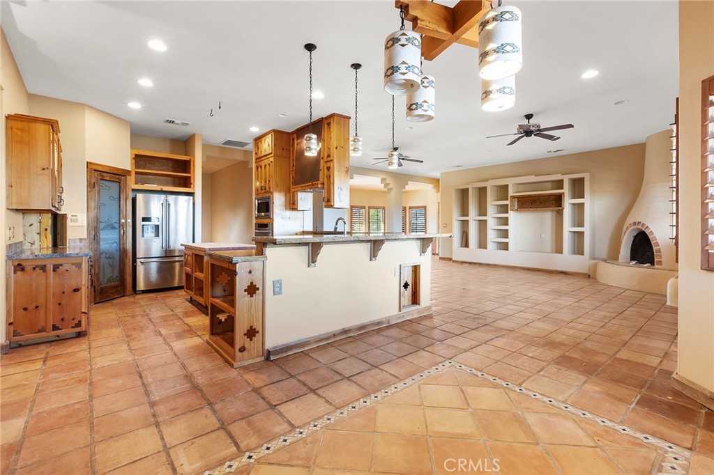 23032 Sky Mesa Road Homeland, CA 92548 - Photo 15 of 58 a view of a kitchen with furniture and a kitchen