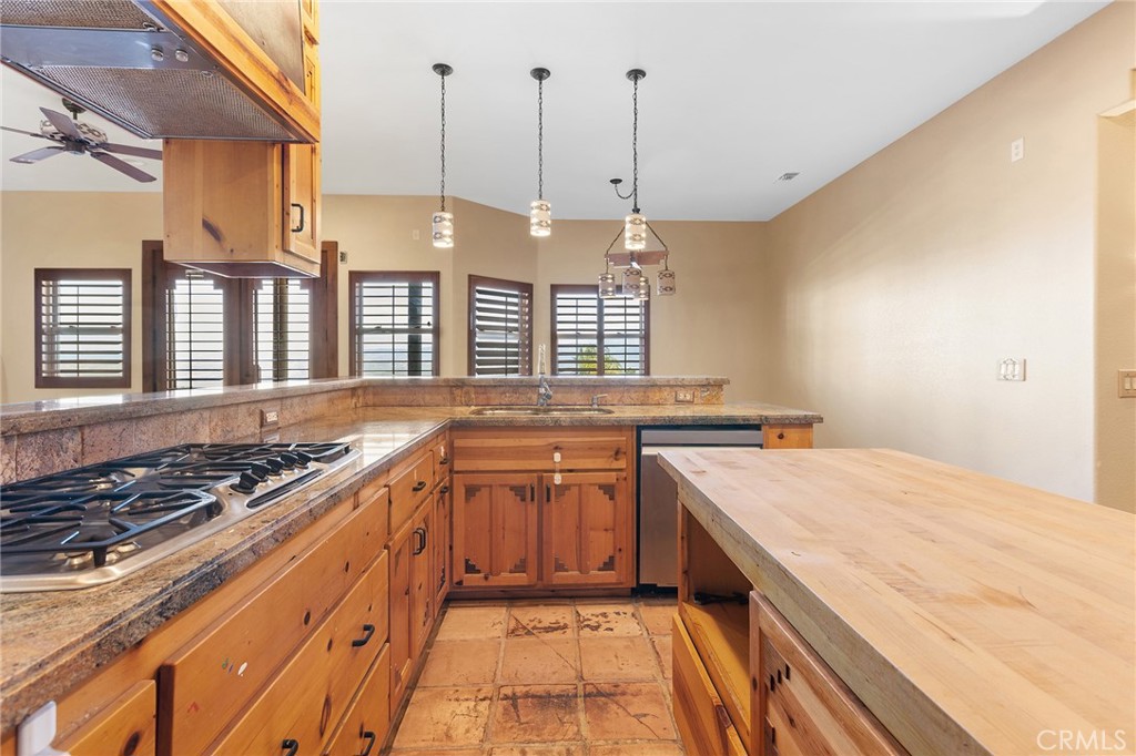 23032 Sky Mesa Road Homeland, CA 92548 - Photo 22 of 58 a large kitchen with a stove