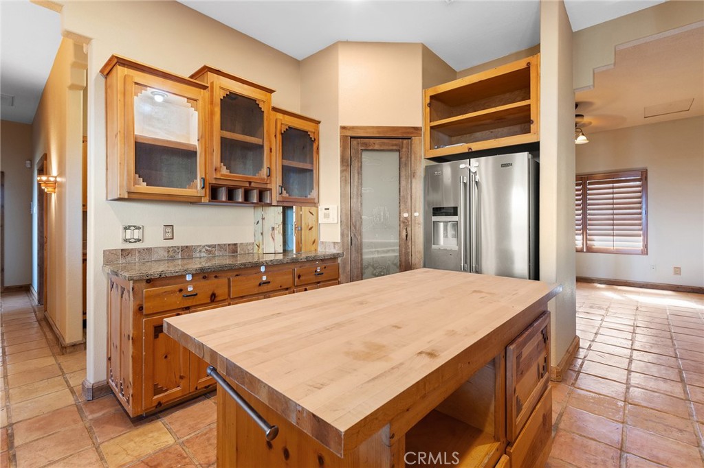 23032 Sky Mesa Road Homeland, CA 92548 - Photo 23 of 58 a kitchen with a stove a sink and a refrigerator