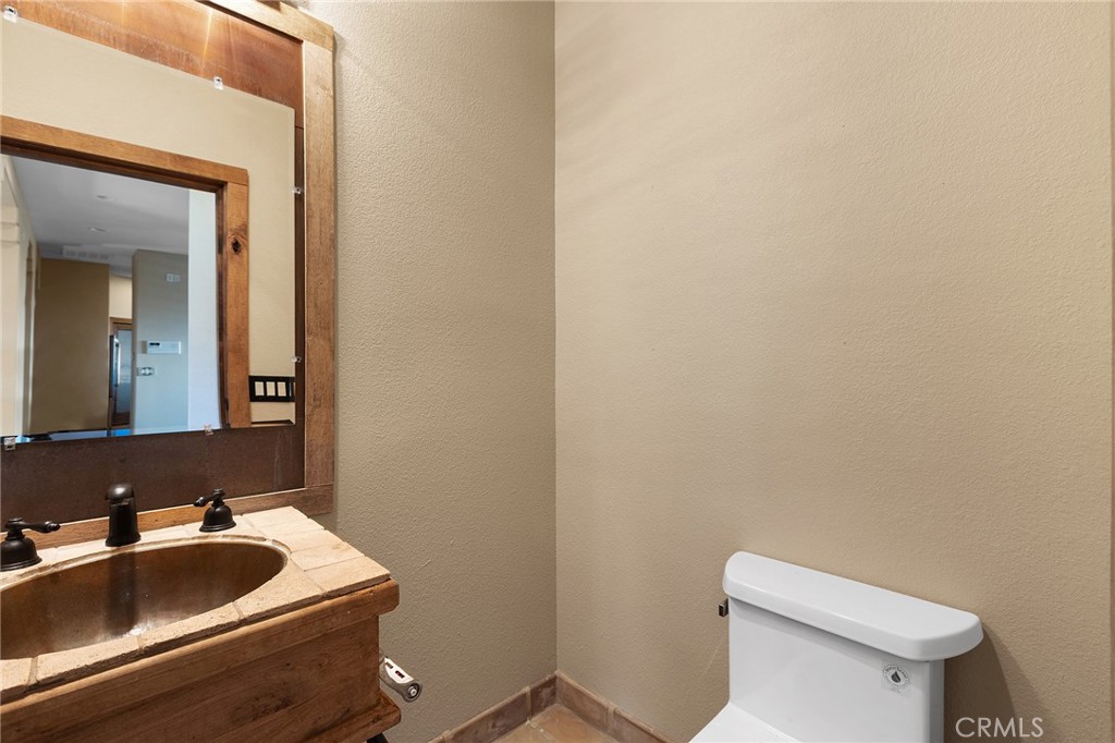 23032 Sky Mesa Road Homeland, CA 92548 - Photo 25 of 58 a bathroom with a sink and toilet