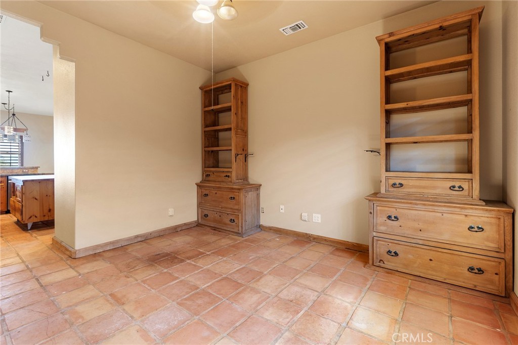 23032 Sky Mesa Road Homeland, CA 92548 - Photo 26 of 58 a view of an empty room with cabinet and a window