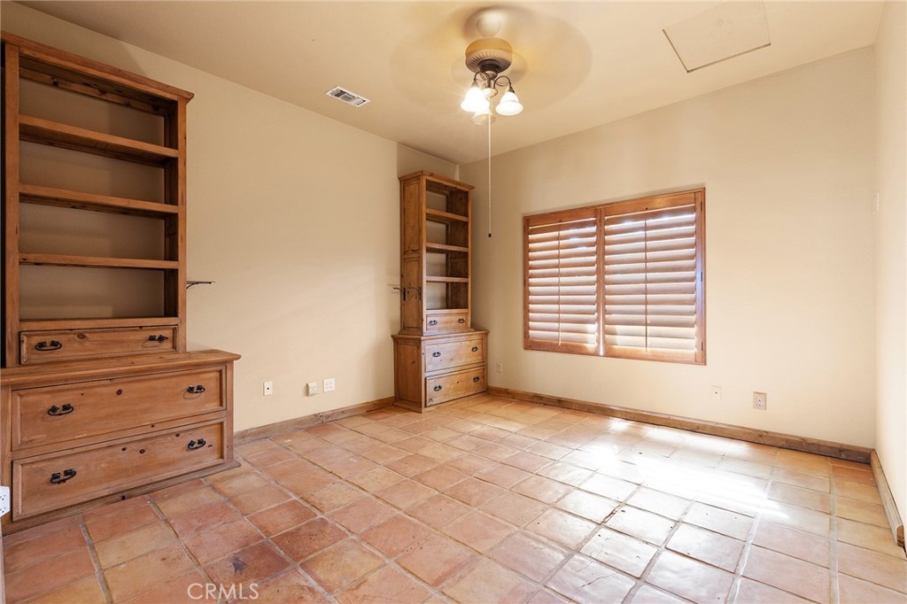 23032 Sky Mesa Road Homeland, CA 92548 - Photo 27 of 58 a view of an empty room with a window and cabinet
