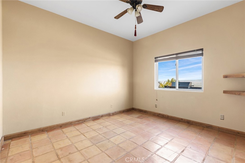 23032 Sky Mesa Road Homeland, CA 92548 - Photo 32 of 58 a view of an empty room with a window