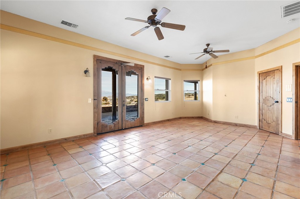 23032 Sky Mesa Road Homeland, CA 92548 - Photo 33 of 58 a view of a livingroom with a ceiling fan and window