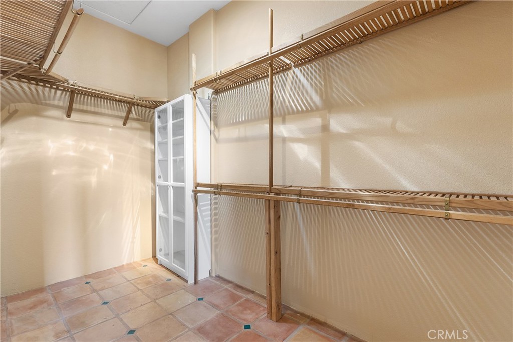 23032 Sky Mesa Road Homeland, CA 92548 - Photo 37 of 58 a view of a room with racks on the wall