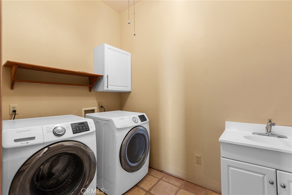 23032 Sky Mesa Road Homeland, CA 92548 - Photo 42 of 58 a utility room with dryer and washer