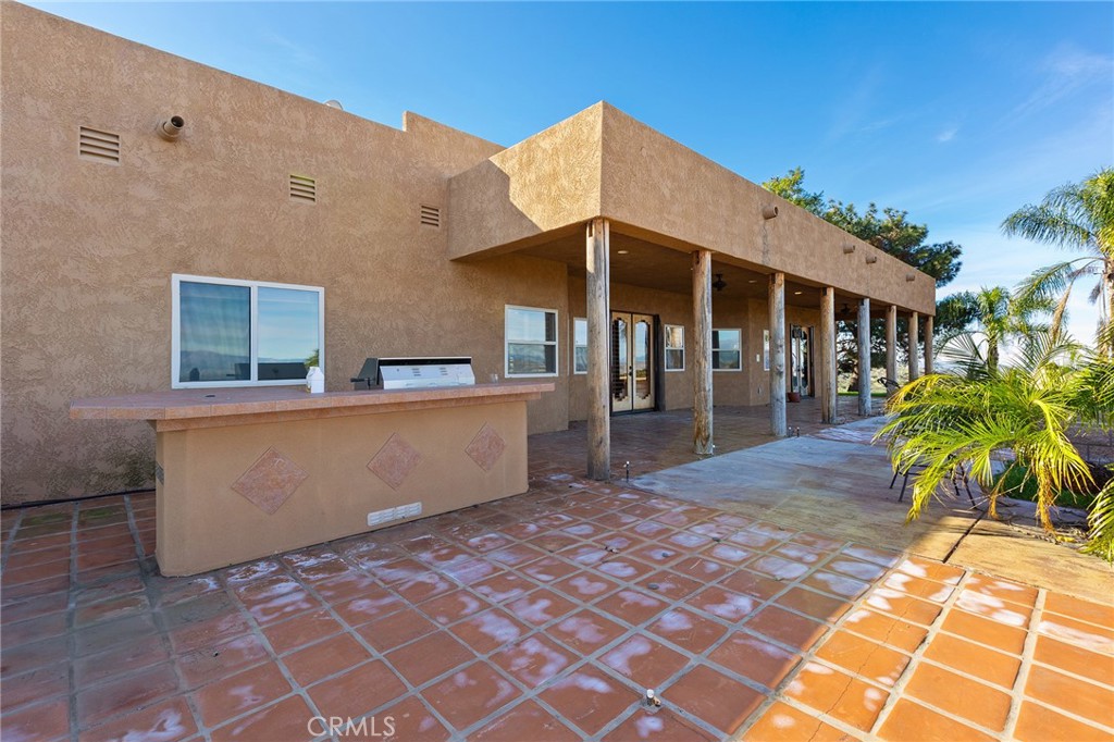 23032 Sky Mesa Road Homeland, CA 92548 - Photo 46 of 58 a view of a house with a backyard