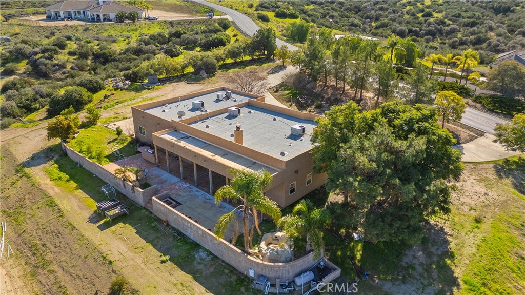 23032 Sky Mesa Road Homeland, CA 92548 - Photo 53 of 58 a view of a house with a trees in front of it