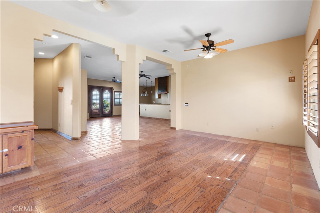 23032 Sky Mesa Road Homeland, CA 92548 - Photo 6 of 58 a view of a livingroom with a chandelier fan and wooden floor