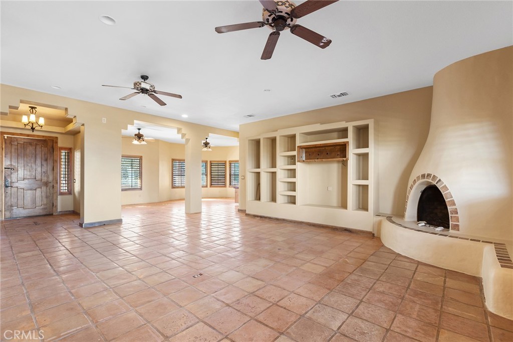 23032 Sky Mesa Road Homeland, CA 92548 - Photo 9 of 58 a view of a livingroom with a fireplace and furniture